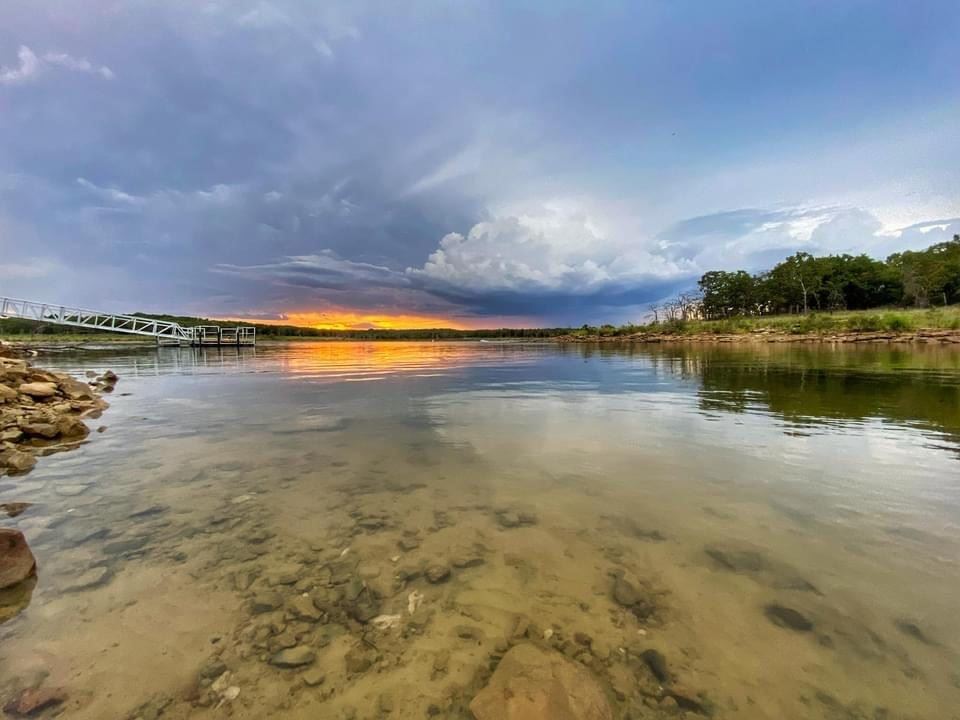 View of the bottom of the lake through the water.